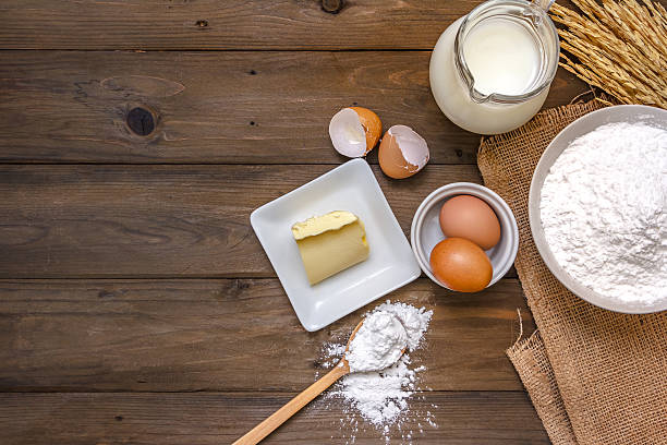 istock baking background with raw eggs, butter and flour 636510720
