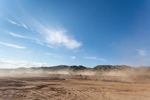 dusty construction site the dust was blowing in busy construction site against a blue sky building sand stock pictures, royalty-free photos & images