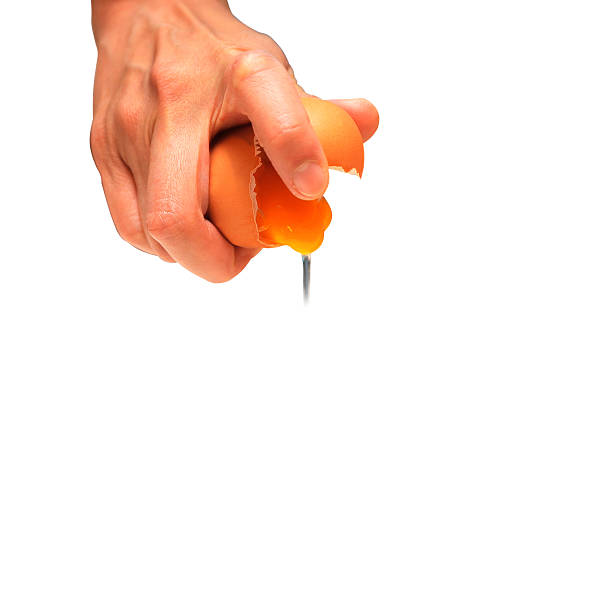 istock Hand of man to crack egg concept on white background 636513088