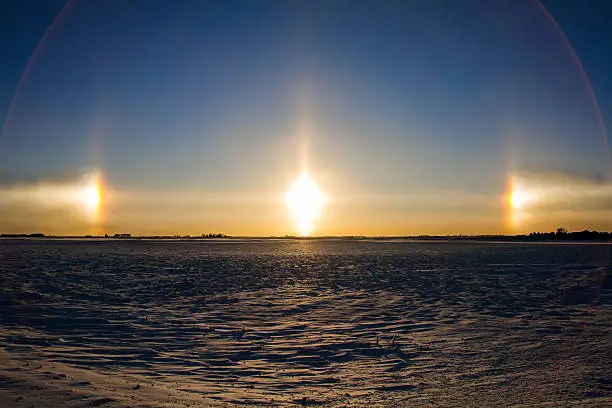 A sundog on a very cold day during sunset.