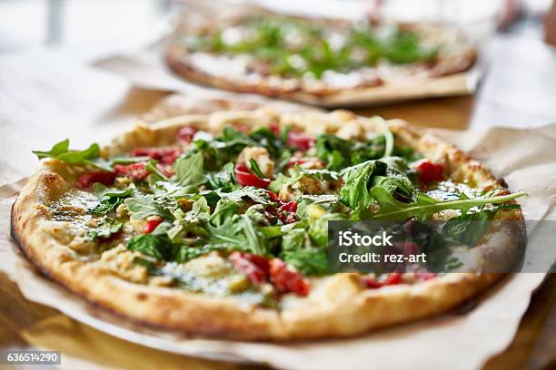 Authentic Gourmet Pizza With Fresh Arugula Pesto And Chicken Stock Photo - Download Image Now