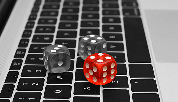 istock Red Color Dice with Black and white keyboard close up 636516544