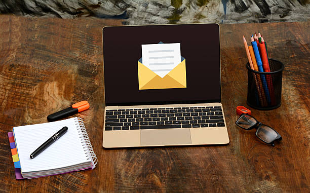 istock Laptop and office electronic communication with New Email Notification 636519184