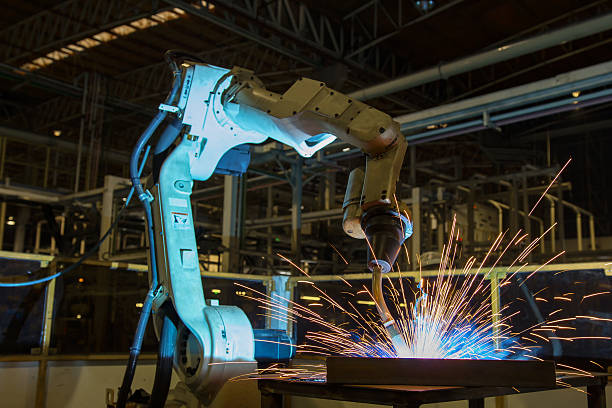 Robot welding in car factory Industrial welding robots in production line manufacturer factory word processing stock pictures, royalty-free photos & images