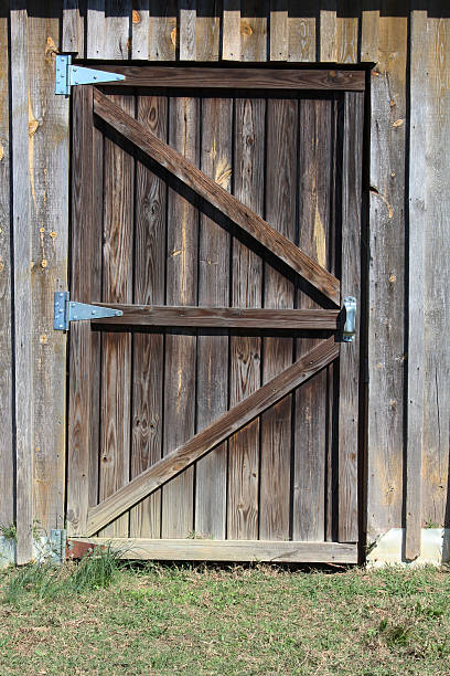 istock Weathered wood barn door entrance 636521694