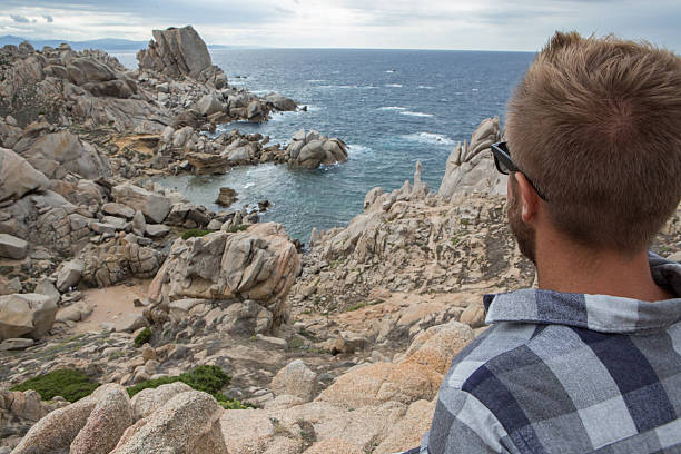 istock One young man relaxing by the sea 636522294