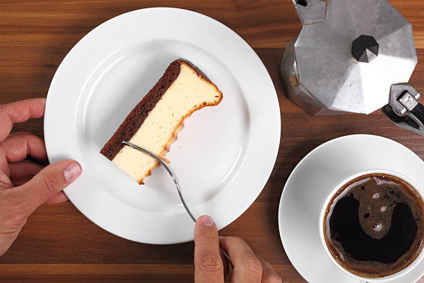 istock Eating Cheesecake and coffee cup. Directly Above. 636525420