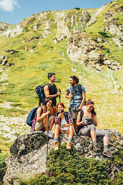istock Friends browsing the net in the mountain 636526440