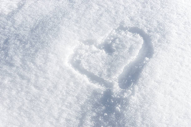 istock Heart painted on the fresh white snow 636526562