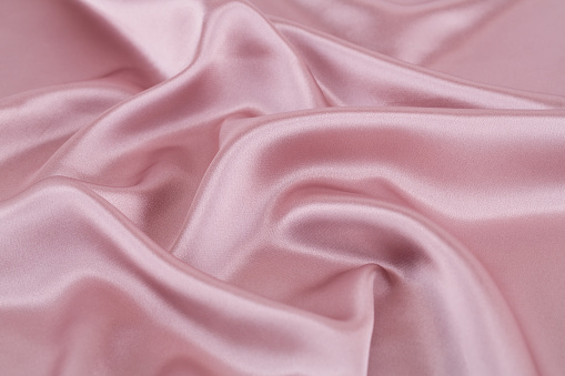 Pink silk fabric for background.