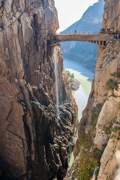 istock Visitors crossing the suspension bridge at Caminito del Rey Path 636527948