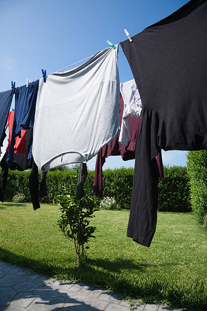 istock shirts hanging in exterior clothesline 636528926