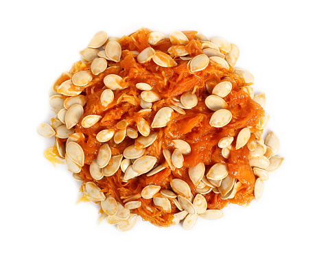Seeds and pulp of pumpkin. Isolated on white background.