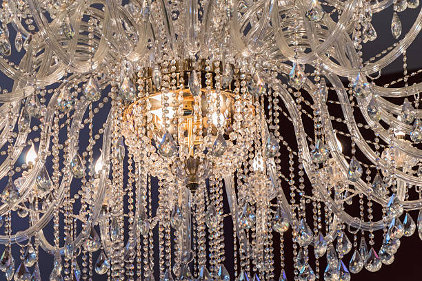 istock Chandelier, luxury retro style on dark background 636530312
