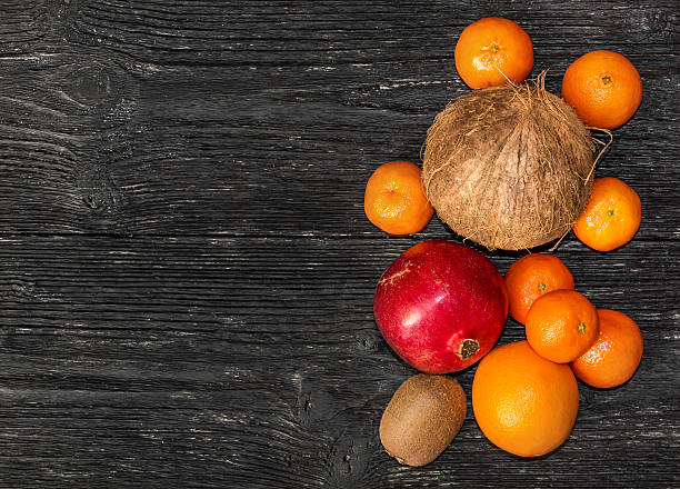 istock Fruits on wooden background. Top view. 636531630