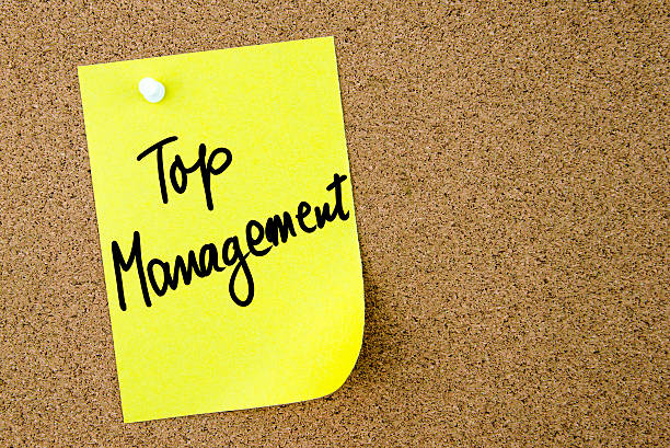istock Top Management text written on yellow paper note 636531910