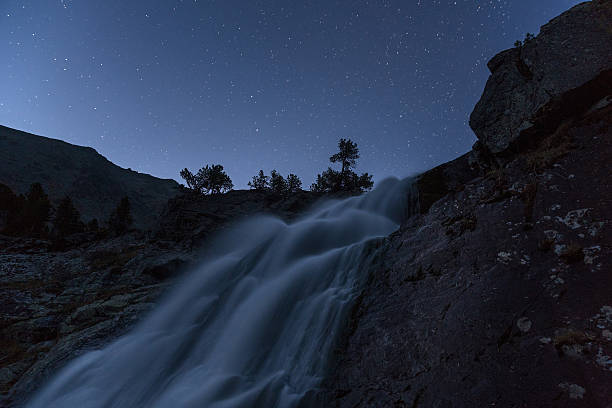 istock Misty Waterfall Long Exposure Early Night View With Stars On 636532006