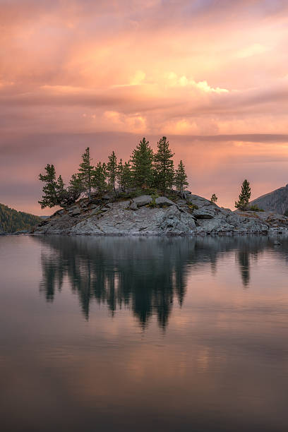 istock Rocky Island With Pine Trees On The Mountain Lake At 636532782