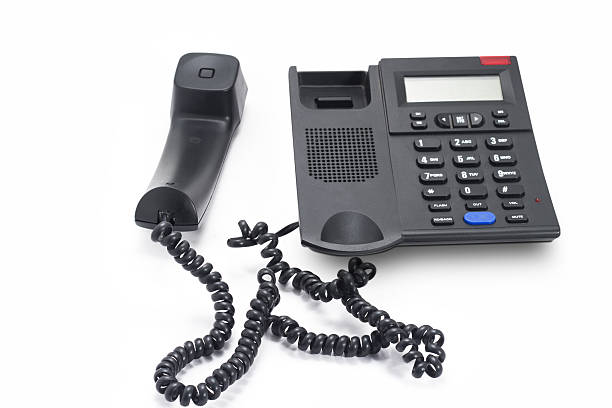istock Landline phone and reciever kept apart on the table 636533504
