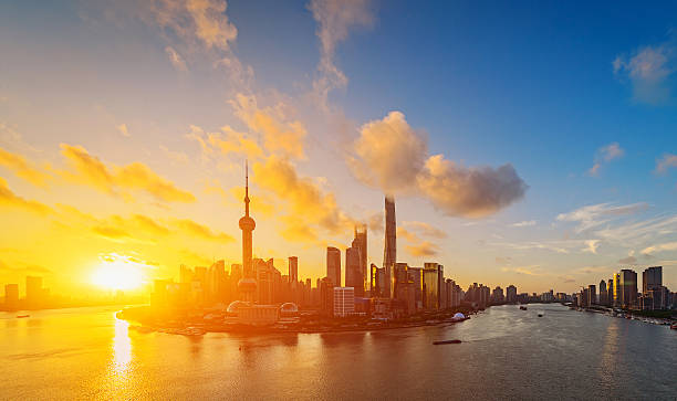 istock Waterfront cityscape and panoramic skyline at sunrise 636533548
