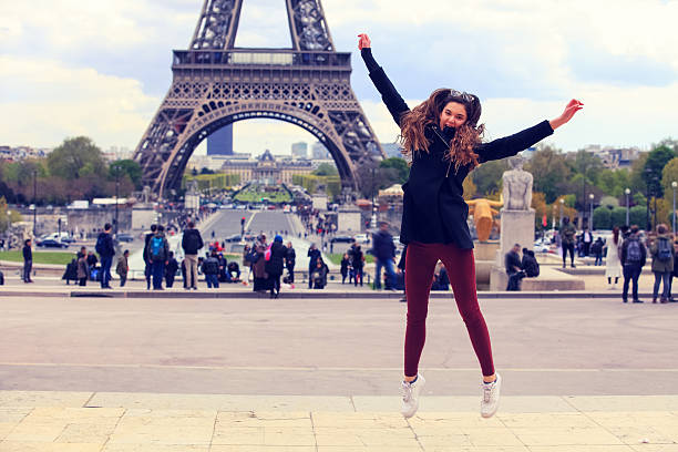 istock Young girl jumping against Tour Eiffel 636534730