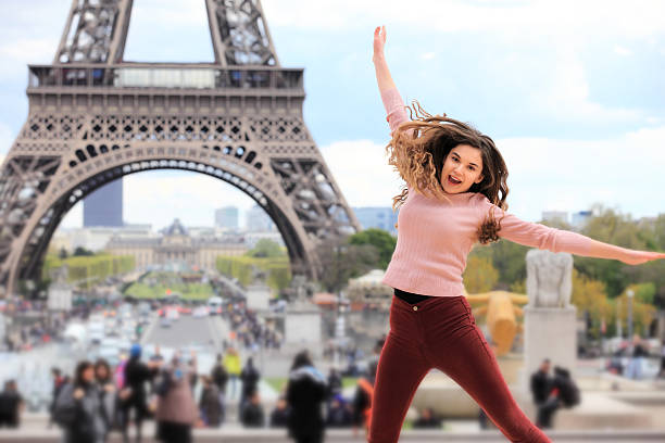 istock Young girl jumping against Tour Eiffel 636534802