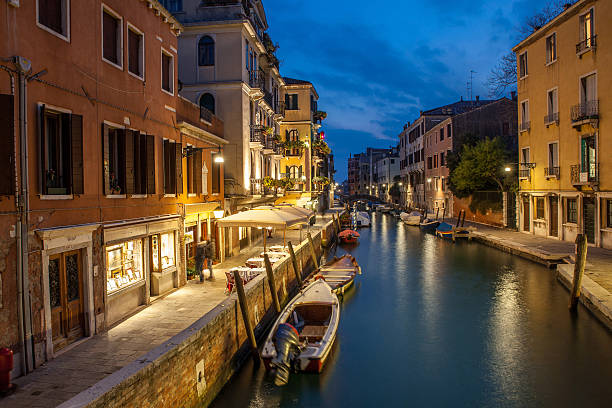 istock boats stand at pier in night Venice 636538256