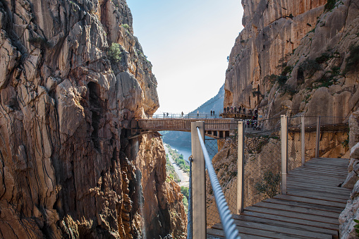 Visitors crossing the suspension bridge at Caminito del Rey Path