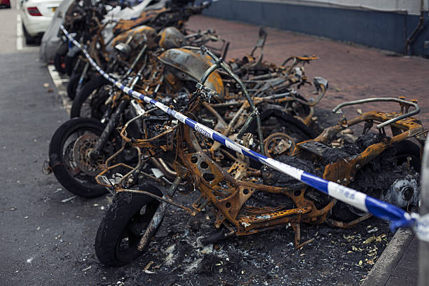 Closeup burnt out motorcycle, background with copy space