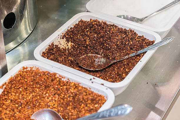 istock Ground red pepper and dried peppers closeup 636545138