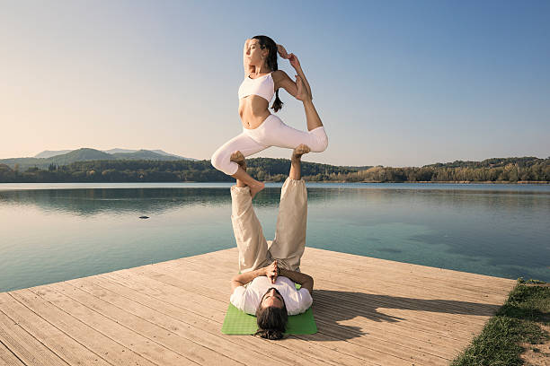 istock Acroyoga Eka On Rajakapotasana pose 636545412
