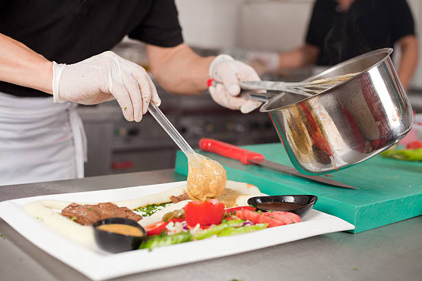 istock chef Preparing food for sevice 636546268