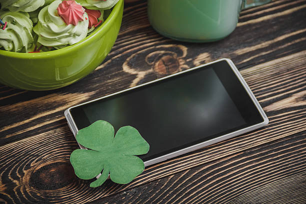 cellphone with clover stock photo