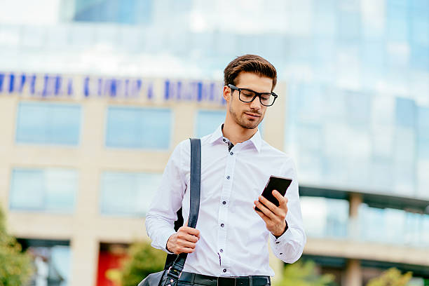 istock Handsome man in white shirt discussing investments 636547308