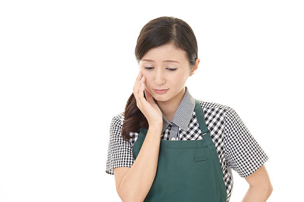 istock Uneasy Asian woman 636549892
