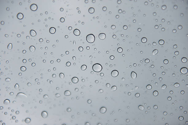 istock drop of water with gray background 636557552