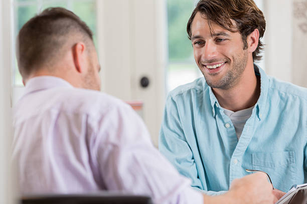 istock Cheerful Caucasian businessman meets with client 636557992