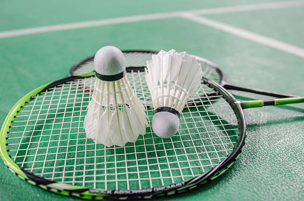 shuttlecock on badminton racket. shuttlecock on badminton racket. badminton stock pictures, royalty-free photos & images
