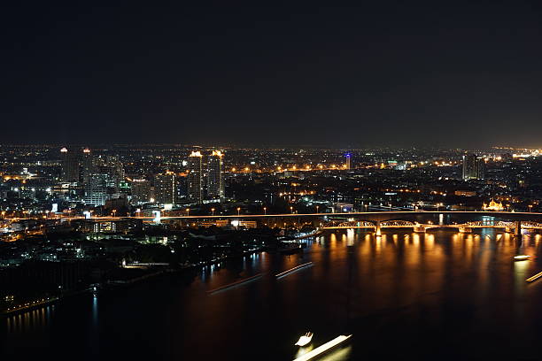 istock Bangkok city river side at night ,bird eye view 636564716
