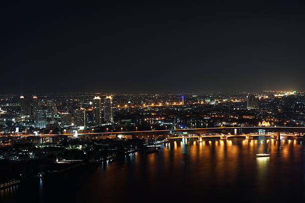 istock Bangkok city river side at night ,bird eye view 636564758