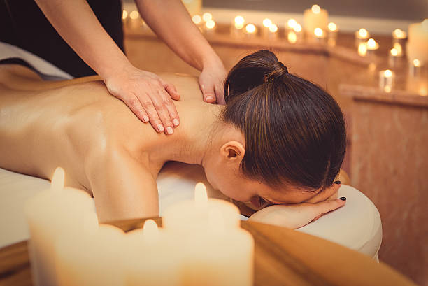 istock Relaxed girl getting massage at spa 636564788