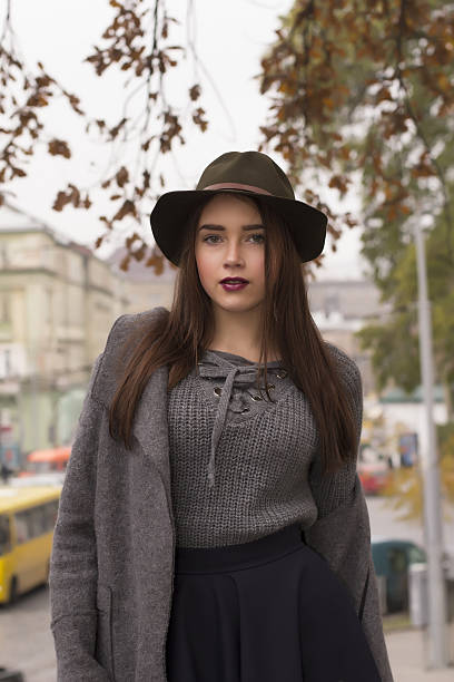 istock Fashionable model in hat walking at the sreet 636565352
