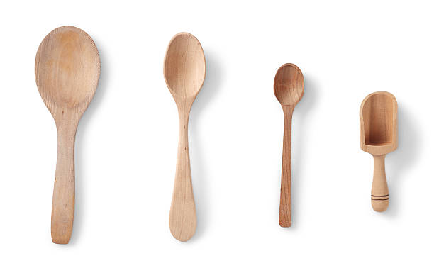 Isolated wooden spoons Isolated wooden spoon with clipping path wooden spoon stock pictures, royalty-free photos & images