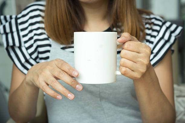 istock Coffee cup in woman hand 636565996