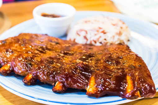 Homemade Plate of barbecue pork ribs and rice.