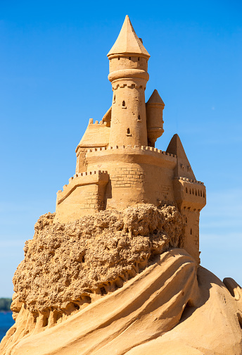 Samara, Russia - June 7, 2014: A beautiful sculpture of sand castle against blue sky during Sand Sculpture Festival \