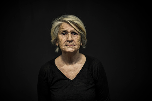 Senior Woman Portrait Front of a Black Background