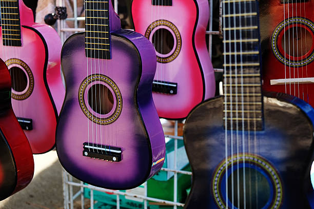 istock Small Colorful Guitars on Display for Sale 636576624