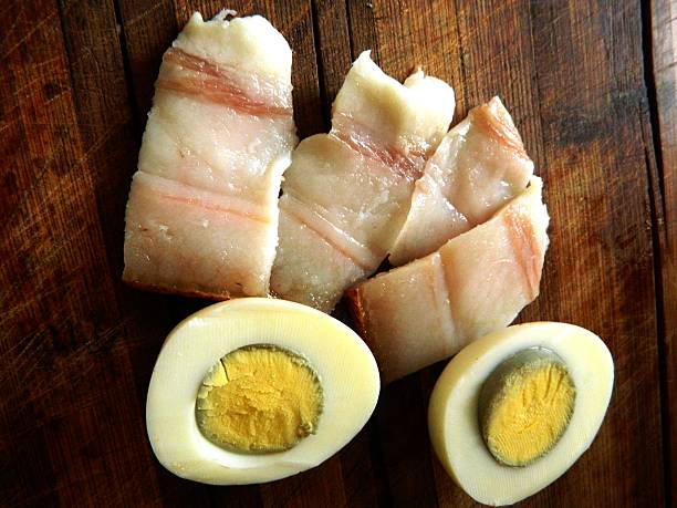 istock half a boiled egg with sliced ​​pieces of bacon 636576764