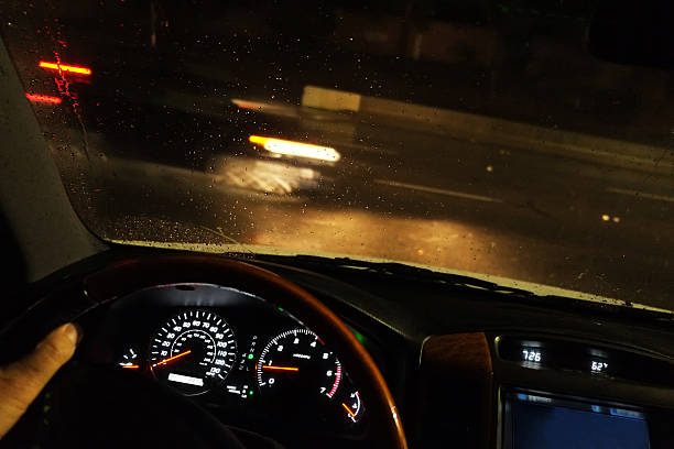 istock Driving Car aon a Rainy Night 636577208